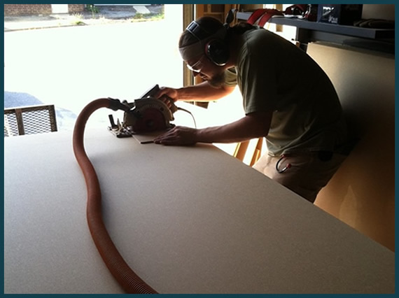Showroom construction with debris and dust containment system.