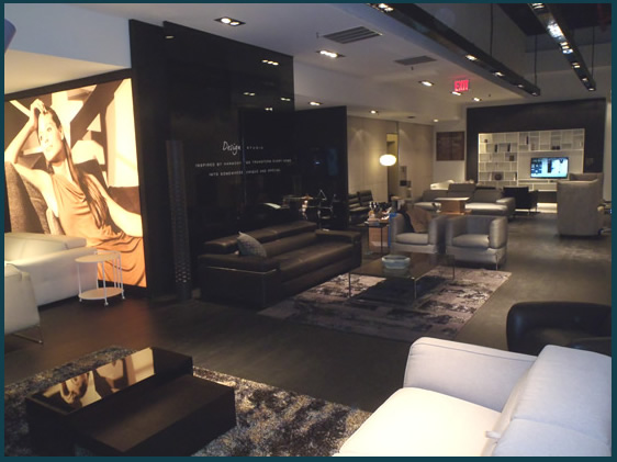 Floating wall construction with lighted photograph over lay.