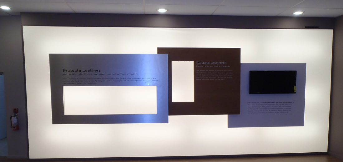 Product endorsement and information on lightbox wall.